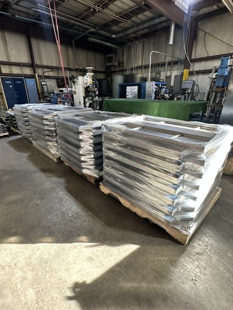MLC Manufacturing — pallets of fabricated steel frames