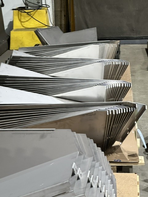MLC Manufacturing — stacked formed sheet metal panels