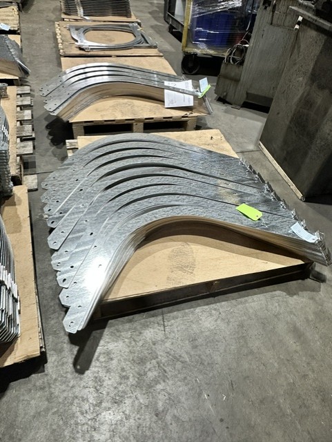 MLC Manufacturing — curved formed metal parts