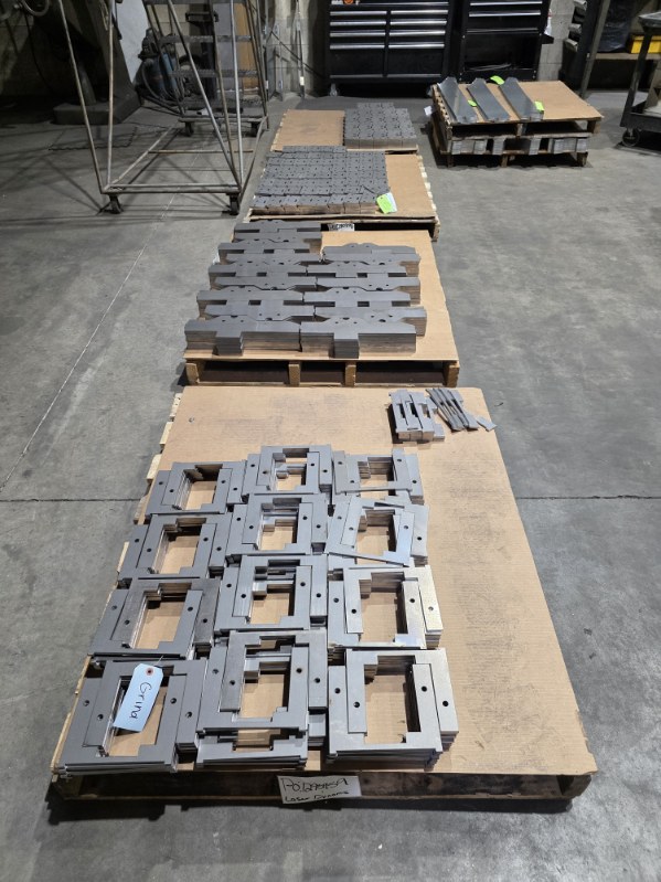 MLC Manufacturing — laser cut steel frames on pallets
