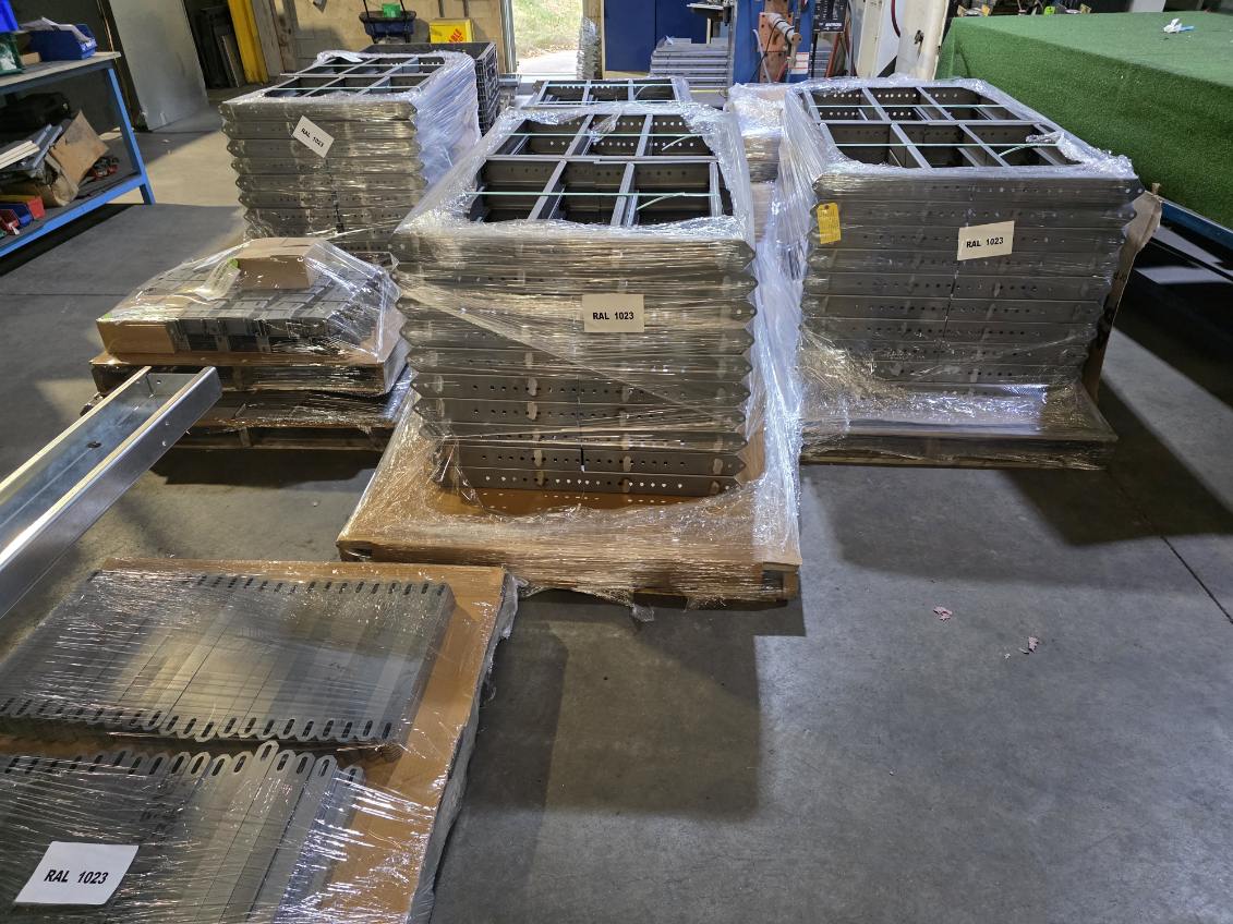 MLC Manufacturing — wrapped pallets of fabricated steel parts